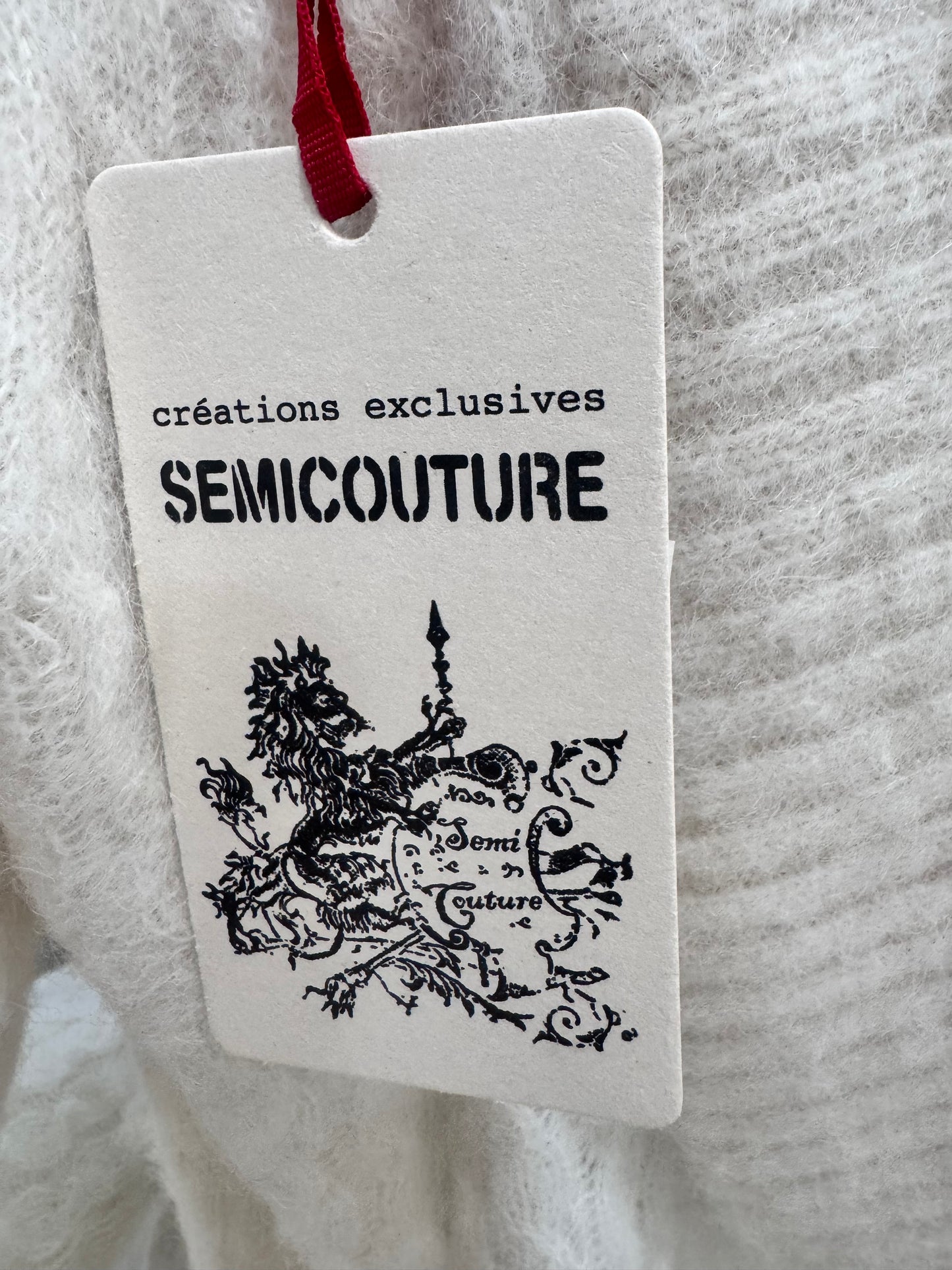 Maglia bianca Semicouture in alpaca e lana vergine con scollo sulla schiena